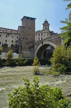 Photo of Castello Caetani Historical landmark, river Tiber and Ponte Fabricio bridge, view from Lungotevere de' Cenci, Rome, Italy