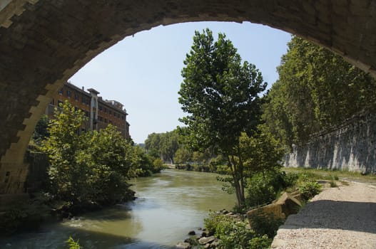 Photo of Fate Bene Fratelli Hospital and river Tiber, view under Ponte Fabricio bridge, Rome, Italy