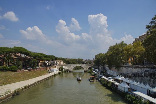 Photo of Fate Bene Fratelli Hospital, Pons Cestius and Tiber river embankment with cafes and restaurants, view from Ponte Garibaldi bridge, Rome, Italy