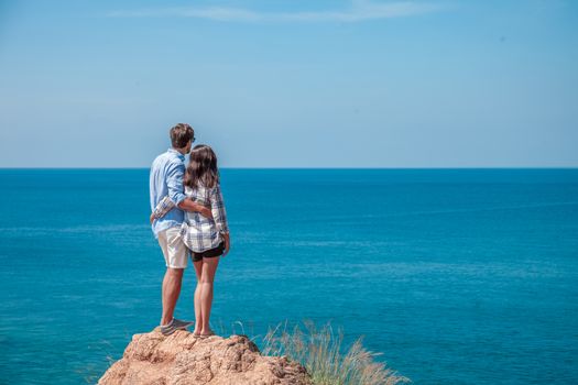 Young couple enjoy beautiful sea view on vacation