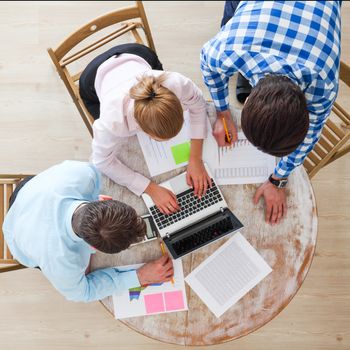 Business team meeting, people in casual clothes working with financial statistics at office desk