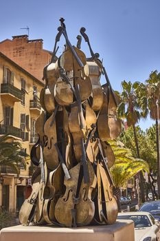 Monument created with pieces of violins stacked among them in the center of Nice City.