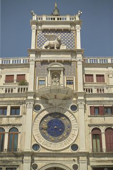 From the bottom of the clock tower in Piazza San Marco in Venice, with its distinctive clock visible.
