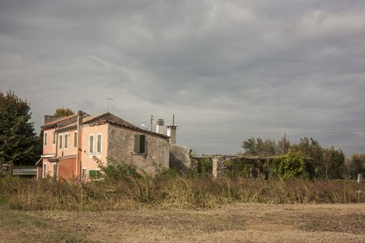 Small abandoned house in a typical countryside area of the Padana plain of Veneto, in the case of Gavello, Rovigo.