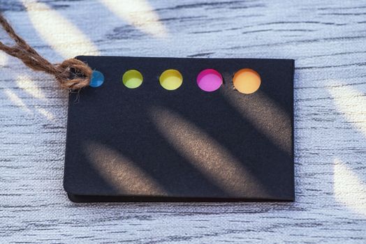 .Business idea concept.Black card with colored bookmarks for notes. Card for notes. Background.