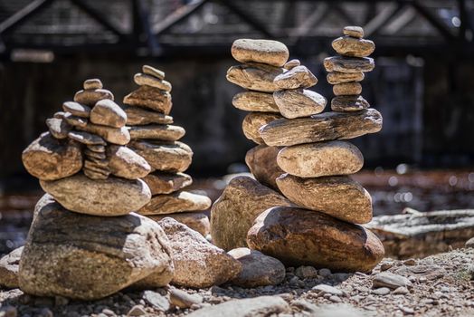 Rocks Stacked Close Up in a river bed.Stack of pebbles. Balancing on a river background.