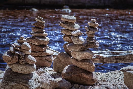 Rocks Stacked Close Up in a river bed.Stack of pebbles. Balancing on a river background.