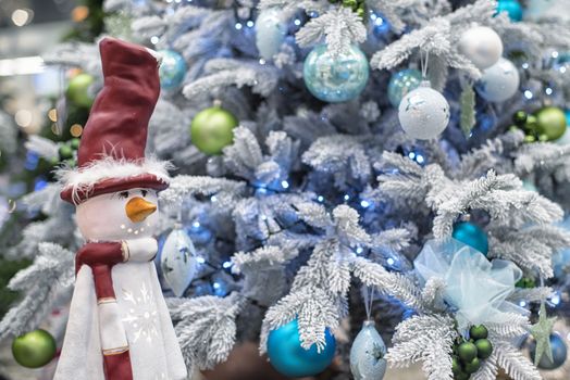 The decor on the Christmas tree on which the New Year's toys are hanging . Xmas concept. soft selective focus