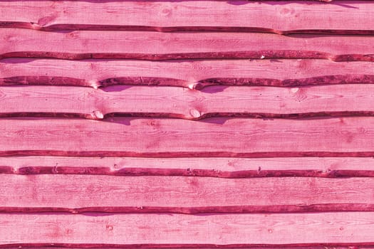 Old pink wood plank background. Wall floor or fence exterior design. Natural wooden material backdrop