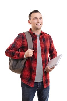 Portrait of a smiling male student in casual clothing, carrying backpack and notebook, isolated on white background.