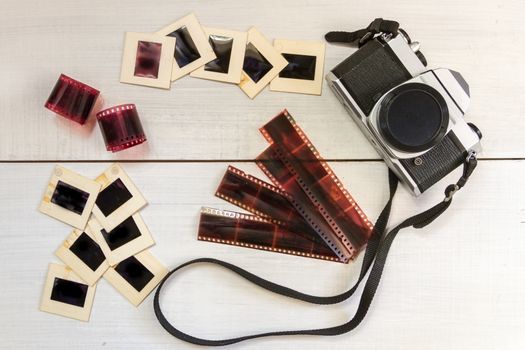 old camera with negatives and slides photography