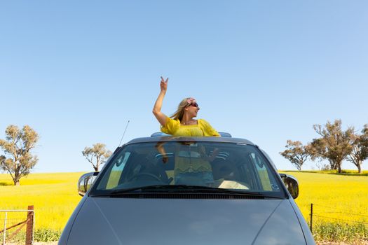 Good vibes road trip to rural countryside fields of golden canola