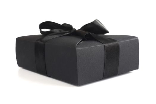 Black friday gift, paper box with silk ribbon bow isolated on white background