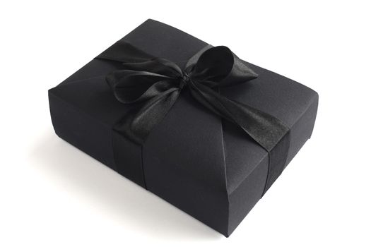 Black friday gift, paper box with silk ribbon bow isolated on white background