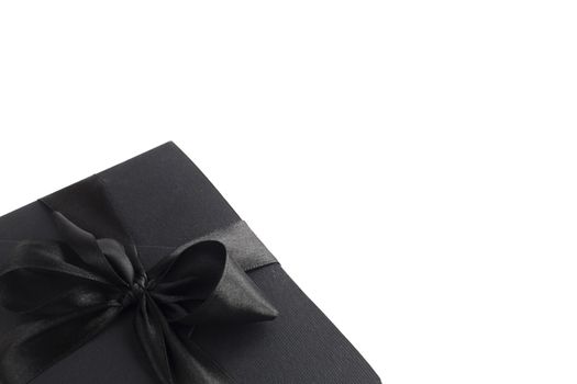 Black friday gift, paper box with silk ribbon bow isolated on white background