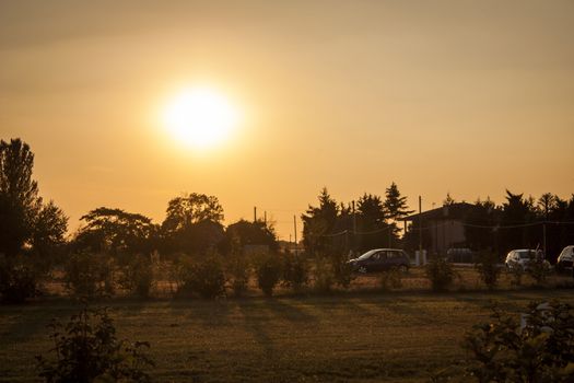 Rural landscape of northern italy resumed at sunset with red light