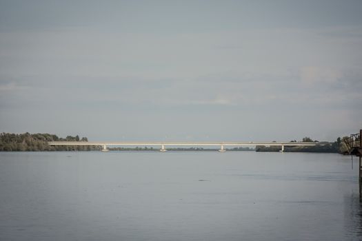 View of a bridge at a point near the delta of the river Po in italy.