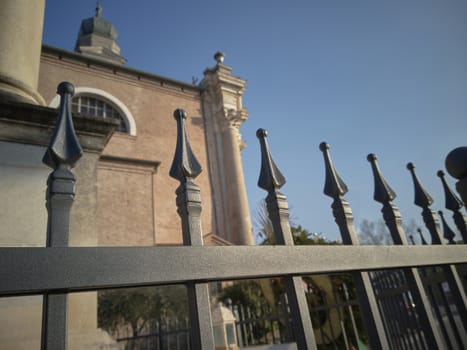 Detail of a fence with wrought iron points on the border and protection of a building.