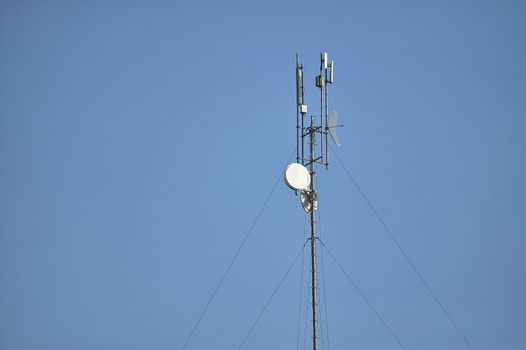 Top of an antenna for receiving and transmitting internet data via satellite connection.
