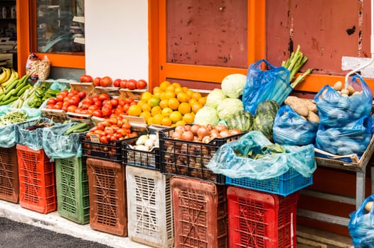 Large amount of fruits displayed in a market with many colors and variety