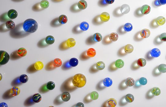 Colorful different Marbles on white background