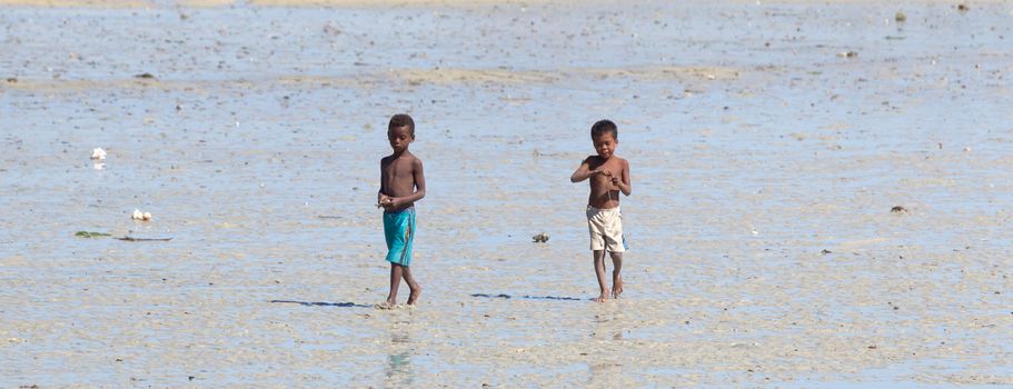 Ifaty, Madagascar on august 2, 2019 - Children playing on the beach on august 2, 2019