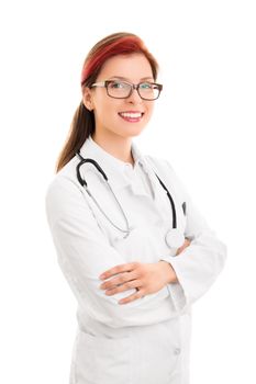 A portrait of a smiling young female health care professional or doctor or nurse with arms crossed in front of her and a stethoscope around her neck, isolated on white background.