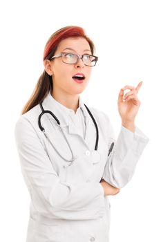 Young female health care professional or doctor or nurse with glasses wearing stethoscope, surprised with an idea or question pointing finger up, isolated on white background. Medical health idea concept.