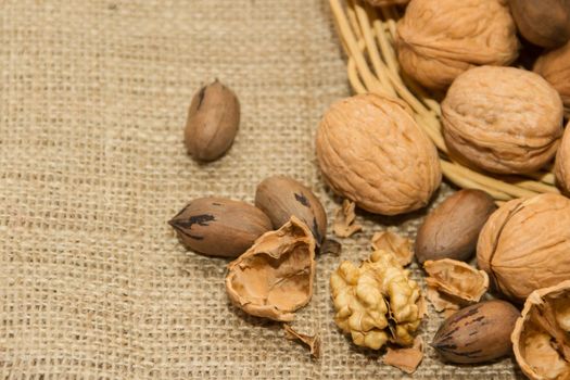 variety of healthy nuts on rustic background