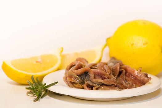 pickled anchovies with rosemary lemon vinegar and tomatoes