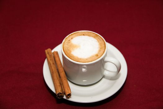 cafe with cinnamon on board background