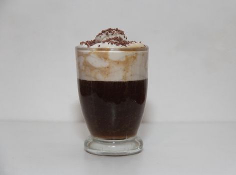 espresso irish coffee with cream and chocolate on white background