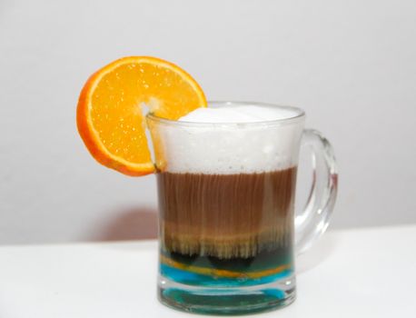 cafe with curacao and orange liqueur on white background