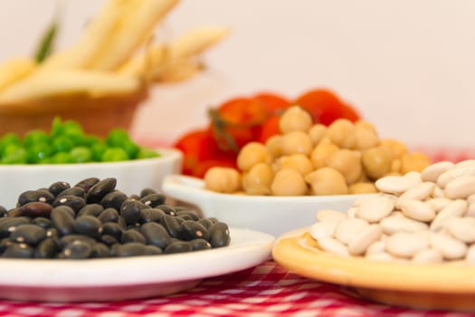 variety of kitchen ingredients with fresh and dried legumes