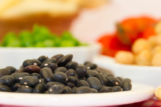 variety of kitchen ingredients with fresh and dried legumes