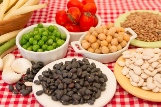 variety of kitchen ingredients with fresh and dried legumes