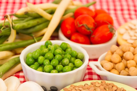 variety of kitchen ingredients with fresh and dried legumes