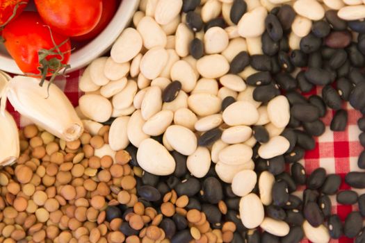 variety of kitchen ingredients with fresh and dried legumes