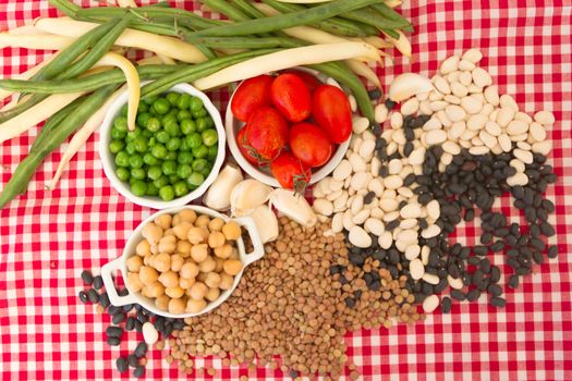 variety of kitchen ingredients with fresh and dried legumes