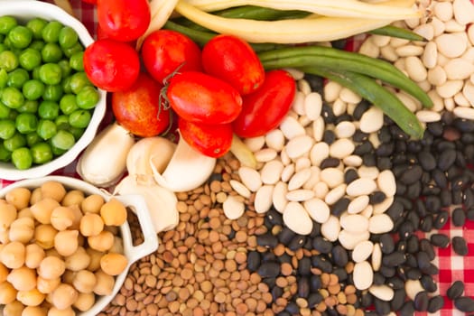 variety of kitchen ingredients with fresh and dried legumes