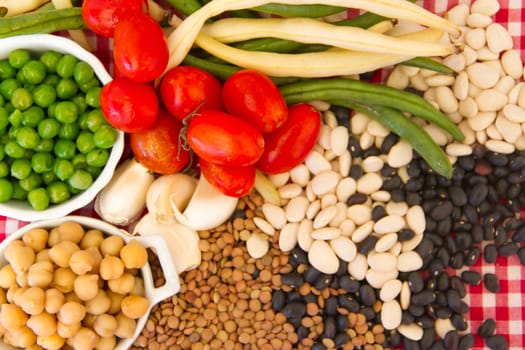 variety of kitchen ingredients with fresh and dried legumes