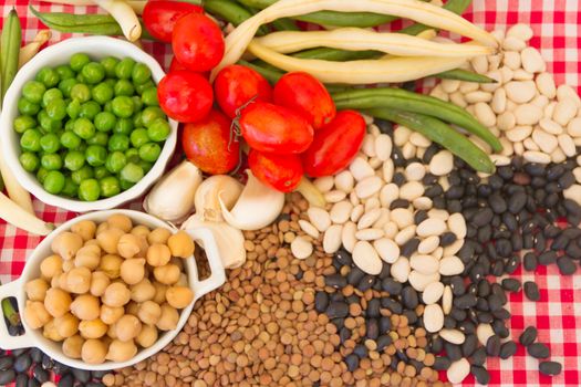 variety of kitchen ingredients with fresh and dried legumes