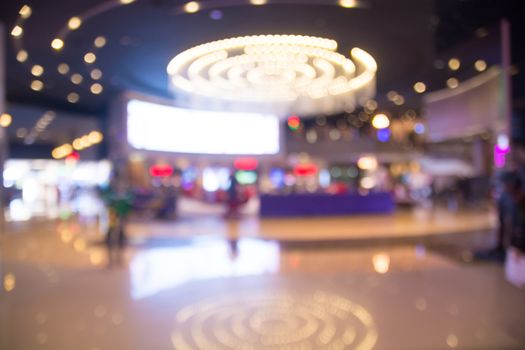 Blur of Defocus Background of People Waiting in Movie or Cinema Complex Lounge