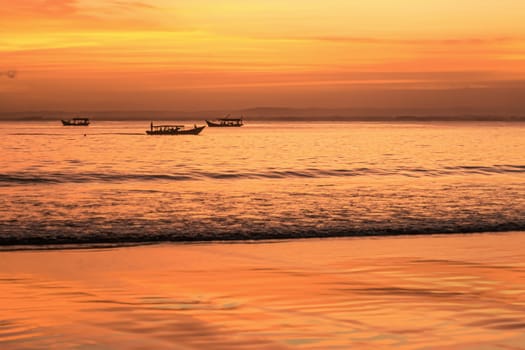Scenic sky and sunset with orange color at Pangandaran Beach