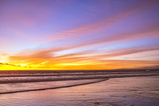 The beauty of the twilight atmosphere at Pangandaran beach with the color of light that makes it calm