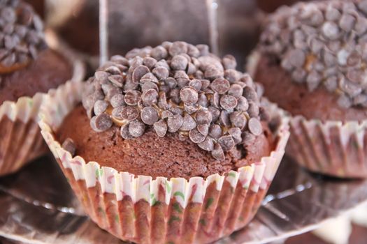 delicious cupcakes and muffins with chocolate and cherries