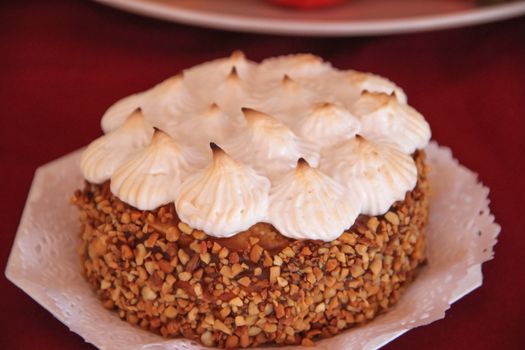 Cakes decorated with chocolate meringue and praline