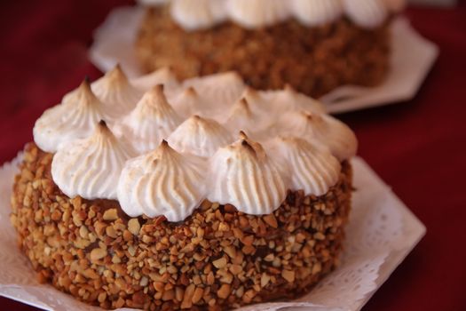 Cakes decorated with chocolate meringue and praline