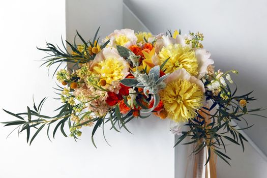 Wedding bouquet of roses, orchids and peonies