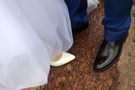 Legs of the groom and the bride